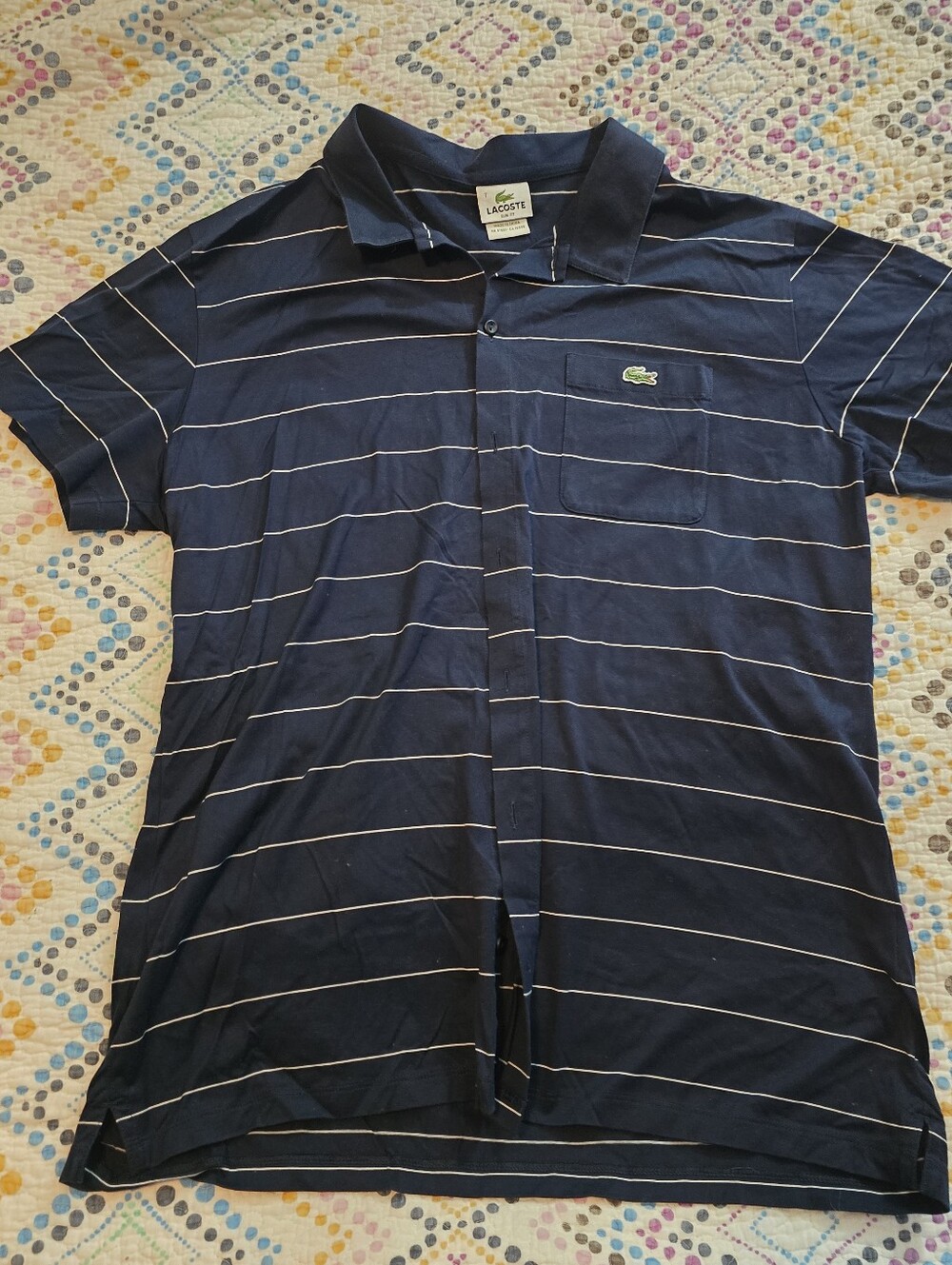 Lacoste button-front polo shirt featuring thin white horizontal stripes